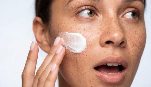 skincare, freckles, woman, face, cream, beauty, natural, cosmetic, moisturizer, skin, dermatology, treatment, wellness, health, routine, close-up, expression, female, portrait, facial, moisturizing, lotion, application, care, freckled